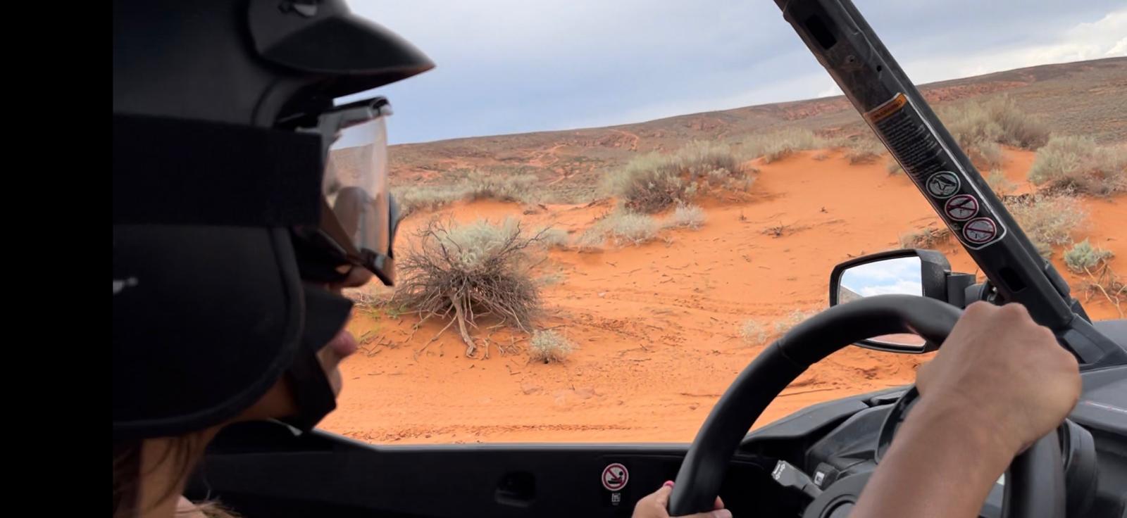 Driver view from inside UTV with helmet on desert trail in Los Cabos